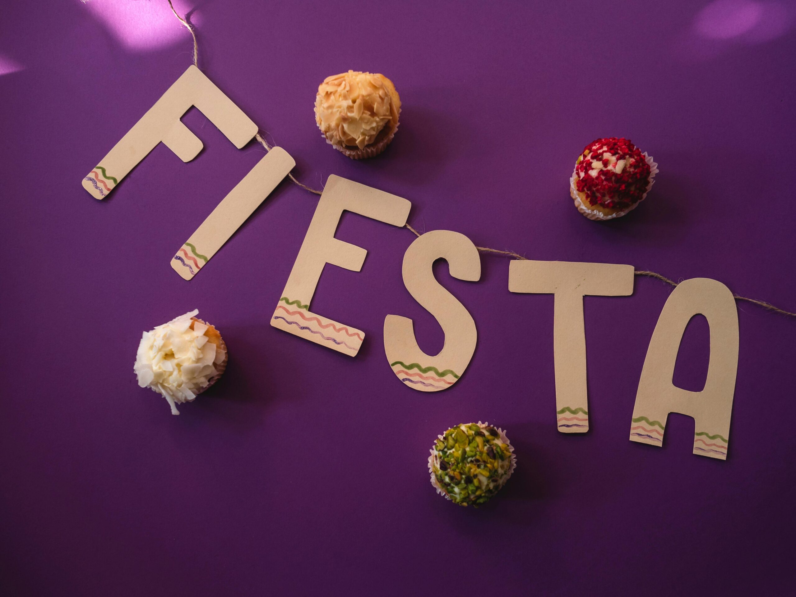 White Cutout Letters on Purple Surface